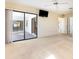 Spacious bedroom with neutral carpet, a ceiling fan, and sliding glass doors leading to additional areas of the home at 31 Bunker Rd, Rotonda West, FL 33947