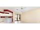 Open living area featuring tile flooring and sliding glass doors leading to the patio and pool area at 31 Bunker Rd, Rotonda West, FL 33947