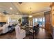 Open-concept dining area with a large table and chairs, adjacent to the living room and kitchen at 336 S Orchid Dr, Ellenton, FL 34222