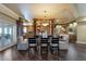 Dining room with a glass table set, hardwood floors, and access to the patio at 336 S Orchid Dr, Ellenton, FL 34222