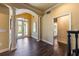 Elegant entryway with white columns, archway, and double doors, offers a grand welcome at 336 S Orchid Dr, Ellenton, FL 34222