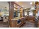 Large kitchen features a center island, custom cabinetry, stainless steel appliances, and an open floor plan at 336 S Orchid Dr, Ellenton, FL 34222