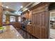 Large kitchen features custom cabinetry, stainless steel appliances, and an open floor plan at 336 S Orchid Dr, Ellenton, FL 34222