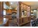 Gourmet kitchen with a center island, custom cabinets, stainless steel appliances, and an open layout at 336 S Orchid Dr, Ellenton, FL 34222
