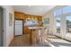 Bright kitchenette featuring modern appliances, breakfast bar and access to outdoor spaces at 336 S Orchid Dr, Ellenton, FL 34222