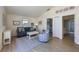 Comfortable living room featuring modern furniture, neutral paint, and access to other rooms at 336 S Orchid Dr, Ellenton, FL 34222