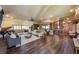 Expansive living room boasts hardwood floors, neutral tones, and ample natural light, perfect for entertaining at 336 S Orchid Dr, Ellenton, FL 34222