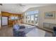 Open living space with bar seating, vaulted ceiling and large glass doors leading to outdoor spaces at 336 S Orchid Dr, Ellenton, FL 34222