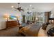 Main bedroom showcases bay views, a coffered ceiling, and custom furniture, offering refined relaxation at 336 S Orchid Dr, Ellenton, FL 34222