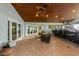 This covered outdoor space features an open floor plan, tile floors, and expansive glass doors for seamless indoor-outdoor living at 336 S Orchid Dr, Ellenton, FL 34222