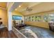 Relaxing sunroom with tile flooring, vaulted ceilings, and ample natural light at 336 S Orchid Dr, Ellenton, FL 34222