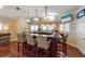 Custom wet bar featuring pendant lighting, a built-in counter, and multiple TV screens at 336 S Orchid Dr, Ellenton, FL 34222