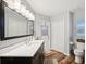 Bathroom features wood-look floors, white countertops, dark vanity, and bright lighting at 3419 31St E St, Bradenton, FL 34208