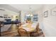 Charming dining area features a wooden table set and natural light, complemented by elegant decor at 3419 31St E St, Bradenton, FL 34208