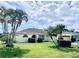 Charming single-story home featuring mature landscaping, a well-manicured lawn, and an attached garage at 3419 31St E St, Bradenton, FL 34208