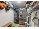 Functional laundry room with stacked washer and dryer and ample shelving space for storage at 3419 31St E St, Bradenton, FL 34208