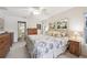 Serene bedroom with a ceiling fan, balcony access, and comfortable bed set for restful nights at 3419 31St E St, Bradenton, FL 34208