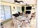 Relax and unwind in the covered patio area, complete with comfortable seating and ceiling fans at 3419 31St E St, Bradenton, FL 34208