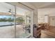 Inviting view of an outdoor patio, pool, and dining room with lovely waterfront views at 3419 31St E St, Bradenton, FL 34208