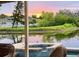 Relaxing pool view with calm water reflections and picturesque sunset at 3419 31St E St, Bradenton, FL 34208