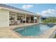 Beautiful pool area with covered patio, ideal for outdoor gatherings and relaxation at 3419 31St E St, Bradenton, FL 34208