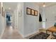 Inviting hallway with tile flooring and neutral paint that leads to other rooms in the home at 3450 77Th W St # 103, Bradenton, FL 34209