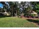 A nice green backyard and seating area to entertain at 3461 Tallywood Cir # 7067, Sarasota, FL 34237