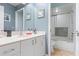 Bathroom with marble countertop, walk in shower, tile flooring, and neutral paint at 3461 Tallywood Cir # 7067, Sarasota, FL 34237