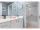 Bathroom with marble countertop, walk in shower, tile flooring, and neutral paint at 3461 Tallywood Cir # 7067, Sarasota, FL 34237