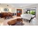 This well-lit living room features marble floors, sliding glass doors, and a comfortable seating area at 3461 Tallywood Cir # 7067, Sarasota, FL 34237