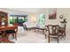 Elegant living room featuring natural light, stylish furnishings, and views of the outdoors at 3461 Tallywood Cir # 7067, Sarasota, FL 34237