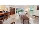 Comfortable living room with dining area, and access to sunroom, perfect for relaxing or entertaining at 3461 Tallywood Cir # 7067, Sarasota, FL 34237