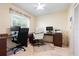 Functional home office space with a window, a ceiling fan, and plenty of workspace at 3461 Tallywood Cir # 7067, Sarasota, FL 34237
