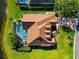 Aerial view of home showing pool, spa, backyard landscaping and neighborhood at 3712 59Th Avenue E Cir, Ellenton, FL 34222