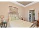 Cozy bedroom with a silver bed frame, side tables, and serene decor at 3712 59Th Avenue E Cir, Ellenton, FL 34222