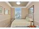 Bedroom with crown molding, large window and natural light at 3712 59Th Avenue E Cir, Ellenton, FL 34222