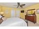 Bedroom with a ceiling fan, closet, and natural light at 3712 59Th Avenue E Cir, Ellenton, FL 34222