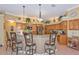 The kitchen is spacious with a breakfast bar and stainless steel appliances at 3712 59Th Avenue E Cir, Ellenton, FL 34222
