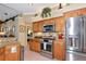 The kitchen features stainless steel appliances, granite countertops, and custom cabinetry at 3712 59Th Avenue E Cir, Ellenton, FL 34222