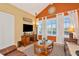Cozy living room with vaulted ceilings, a large window, and comfortable leather seating at 3712 59Th Avenue E Cir, Ellenton, FL 34222