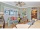 Bright living room includes an opening to the kitchen, neutral tones and large windows for ample light at 3712 59Th Avenue E Cir, Ellenton, FL 34222