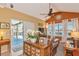 Spacious living room with coffered ceilings, access to the lanai, and comfortable leather seating at 3712 59Th Avenue E Cir, Ellenton, FL 34222