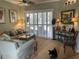Inviting living room features neutral tones, comfortable seating, and sliding doors to a private lanai at 3712 59Th Avenue E Cir, Ellenton, FL 34222