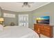 Serene bedroom with large windows for natural light, wood furniture and a calming color scheme at 3712 59Th Avenue E Cir, Ellenton, FL 34222