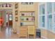 Charming office nook featuring a built-in desk, shelving, and natural light from the shuttered window at 3712 59Th Avenue E Cir, Ellenton, FL 34222