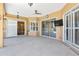 Expansive covered patio with ceiling fan, and multiple access points to the outdoors at 3712 59Th Avenue E Cir, Ellenton, FL 34222