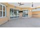 Covered patio with tile flooring, ceiling fan, and sliding glass doors, great for entertaining at 3712 59Th Avenue E Cir, Ellenton, FL 34222
