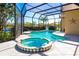 Beautiful screened-in pool and spa overlooking a serene lake, a perfect outdoor oasis at 3712 59Th Avenue E Cir, Ellenton, FL 34222