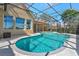 Screened-in pool and spa with a tranquil view, perfect for relaxation and outdoor living at 3712 59Th Avenue E Cir, Ellenton, FL 34222