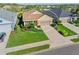 Aerial view of a well-maintained home with a lush green lawn and landscaped surroundings at 3835 Autumn Fern Ter, Sarasota, FL 34243